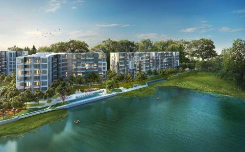 an architectural rendering of an apartment complex next to a river at Cassia Residences in Laguna by Banyan Living in Laguna Phuket