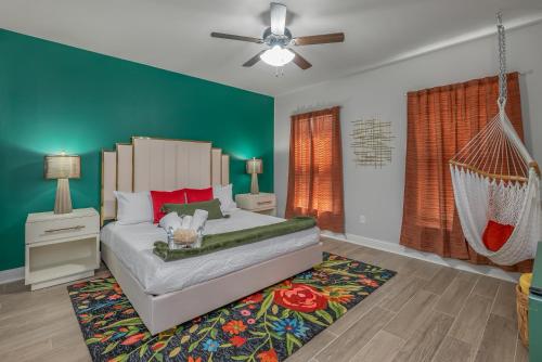 a bedroom with a swinging bed and a hammock at Groovy, New & Modern! Tv in each room in Shreveport