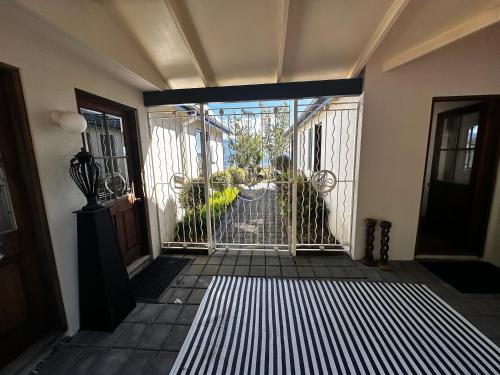 an entrance to a house with a screened in door at Moana Lakeview Chalet in Moana