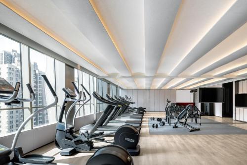 a gym with treadmills and elliptical machines at JOYA Shanghai Gubei in Shanghai