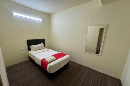 Ένα ή περισσότερα κρεβάτια σε δωμάτιο στο Hotel Seri Warisan Melaka, Stadium Hang Tuah