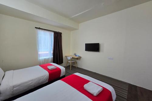 Postel nebo postele na pokoji v ubytování Hotel Seri Warisan Melaka, Stadium Hang Tuah