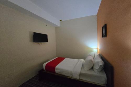 Ένα ή περισσότερα κρεβάτια σε δωμάτιο στο Hotel Seri Warisan Melaka, Stadium Hang Tuah