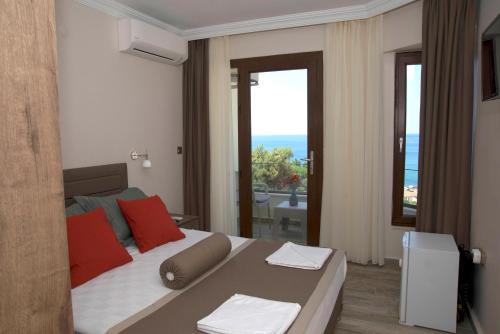 Ένα ή περισσότερα κρεβάτια σε δωμάτιο στο Yasemin Hotel