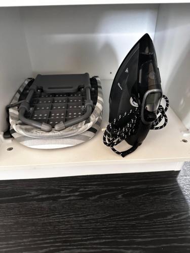 a black phone sitting on top of a shelf at Moana Lakeview Chalet in Moana