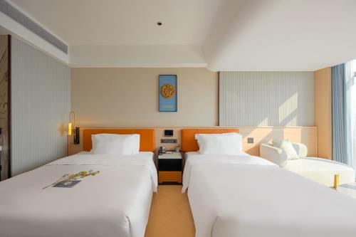 Ένα ή περισσότερα κρεβάτια σε δωμάτιο στο Days Inn by Wyndham Shantou Jinping