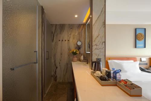 Ένα ή περισσότερα κρεβάτια σε δωμάτιο στο Days Inn by Wyndham Shantou Jinping