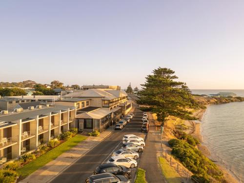 an aerial view of a hotel with cars parked on the street at Ozone Hotel Kangaroo Island in Kingscote