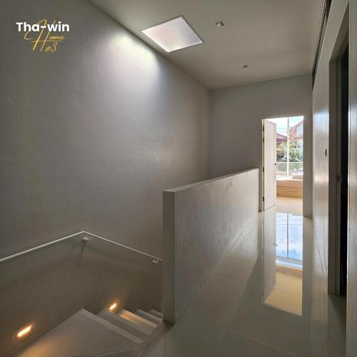 a room with a staircase with lights on the floor at NEW! Tha-win home3 #10minLeegarden #minDimsumChabura in Sathani Hat Yai