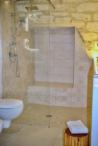 a bathroom with a shower with a toilet and a sink at La Conchiglia in Molfetta
