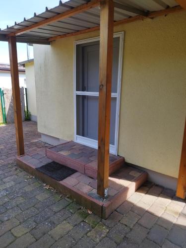 a screened in porch of a house at Bungalow am Schwielochsee 1 in Schwielochsee