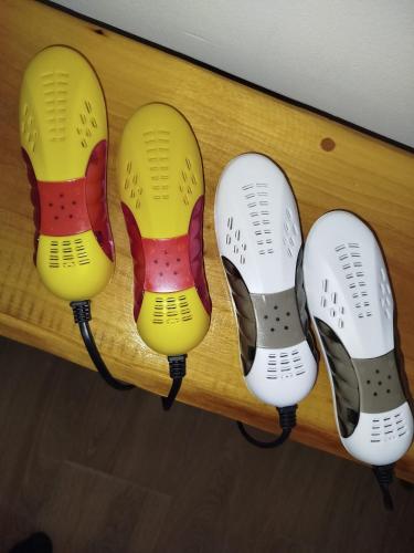 four pairs of shoes hanging on a shelf at Lela Kop in Kopaonik