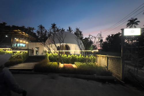 a domed observatory with a sign in front of a building at Sunny Side Resort Koh Tao in Koh Tao