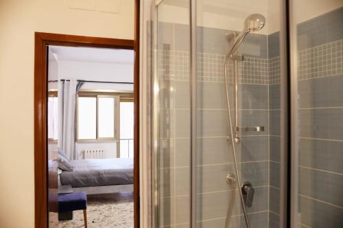 a bathroom with a shower with a glass door at A Casa di Rocco in Rome