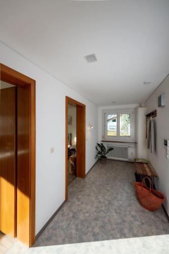 a living room with a door and a window at Ferien im Paradies - Wohnung Prima in Höchst