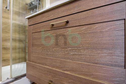a wooden door with the word obo written on it at Luxurious Tsimiski 2nd Floor in Alexandroupoli