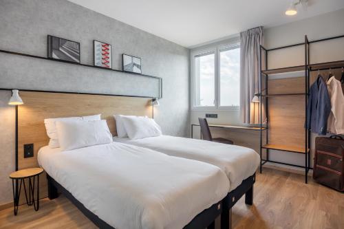 Postel nebo postele na pokoji v ubytování ibis Dijon Sud