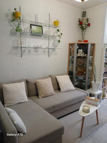 a living room with a couch and a table at Room zellik in Horing