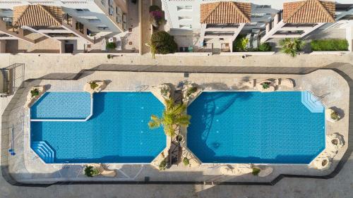 an overhead view of a swimming pool in a building at Royal Seacrest F G6 in Paphos