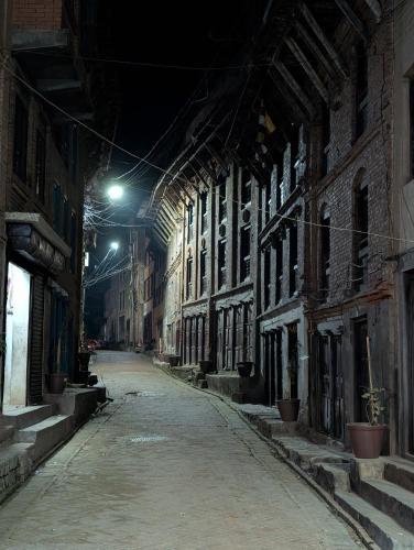 an empty street at night in an old building at Panauti Old Town Community Homestay in Panauti