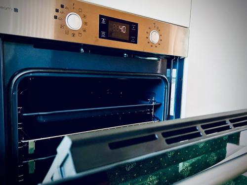 Kuchyň nebo kuchyňský kout v ubytování Das WALDFRIEDE Appartement