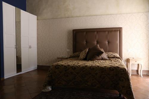 Katil atau katil-katil dalam bilik di B&B Suite Palazzo Luciani