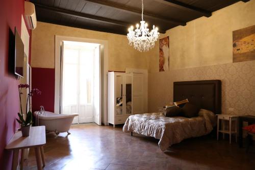 Katil atau katil-katil dalam bilik di B&B Suite Palazzo Luciani