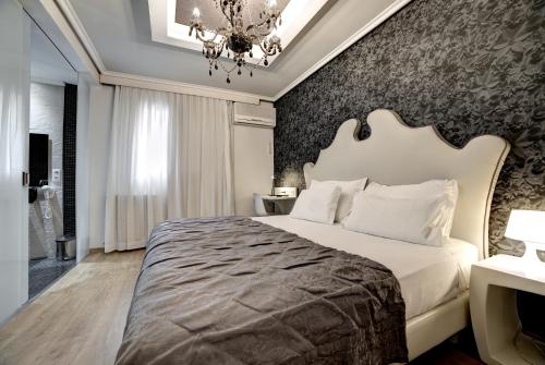 מיטה או מיטות בחדר ב-Hotel Pilar Plaza