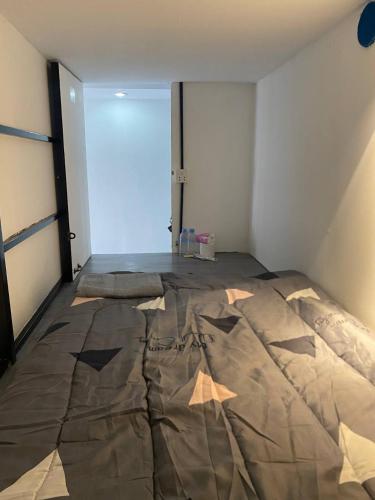 a bedroom with a large bed in a room at The Moonvine on 360 in Phnom Penh