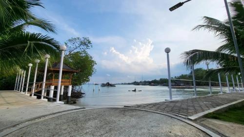a body of water with a gazebo and a river at Bintan Exotica Resort By WH - Free Shuttle BBT Resort BBT - Free Breakfast in Berakit