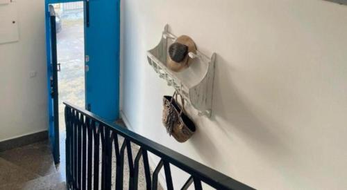 a stairway with shoes hanging on a wall at Mediterranea in Torre Pali 