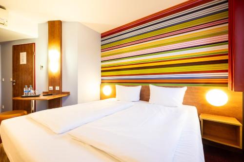Postel nebo postele na pokoji v ubytování Hotel Rhynern Nord