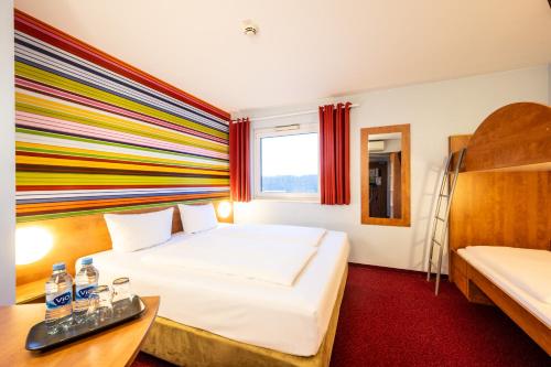 Postel nebo postele na pokoji v ubytování Hotel Rhynern Nord