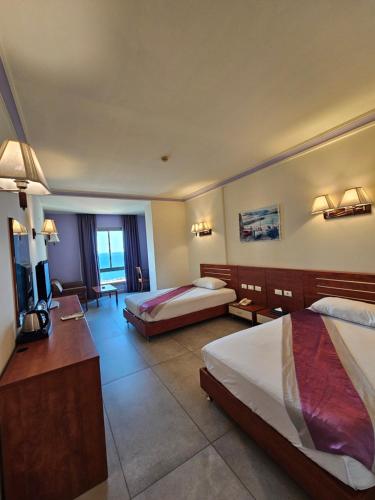 Ένα ή περισσότερα κρεβάτια σε δωμάτιο στο Princessa Hotel