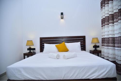 Ein Bett oder Betten in einem Zimmer der Unterkunft Thihawa Yala