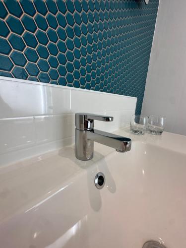 a bathroom sink with a faucet on top of it at Briarwood nr Manchester Airport/Wilmslow in Wilmslow