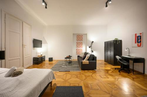 a living room with a couch and a desk at Spacious apartment in Graz for 6 people in Graz