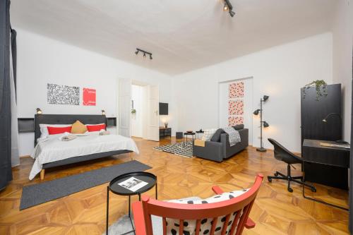 a bedroom with a bed and a living room at Spacious apartment in Graz for 6 people in Graz