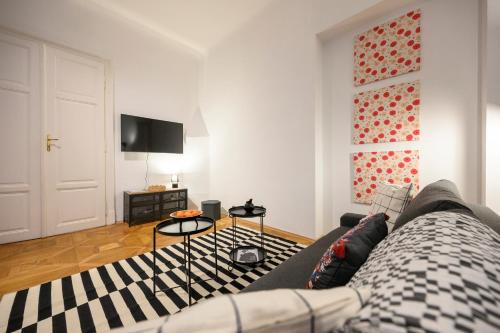 a living room with a couch and a table at Spacious apartment in Graz for 6 people in Graz