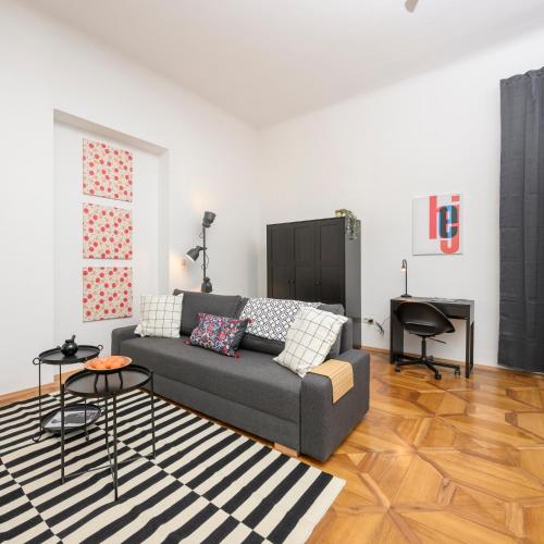a living room with a couch and a table at Spacious apartment in Graz for 6 people in Graz