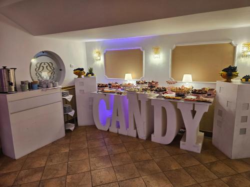 a kitchen with a canopy sign in the middle at Hotel Bulevard in Făgăraş