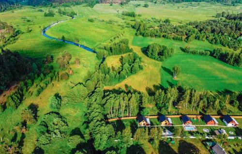 an aerial view of a house in a green field at Stunning Home In Jamno With Sauna in Jamno