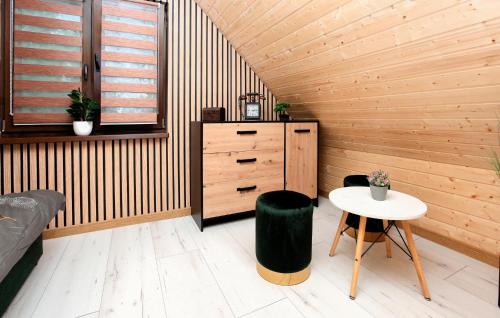 a room with a desk and a table in a room at Stunning Home In Jamno With Sauna in Jamno