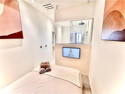 Ένα ή περισσότερα κρεβάτια σε δωμάτιο στο Saint-Tropez Hypercentre