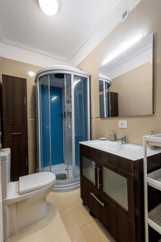 a bathroom with a toilet sink and a shower at Luxury Villa with Pool, Jacuzzi, Cardio area and Gardens by Pámpano Experiences in Puerto de la Cruz