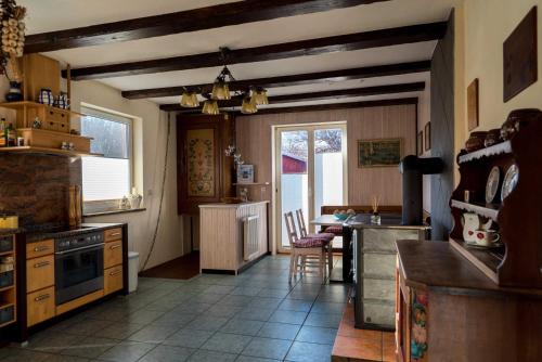 a kitchen with a table and a dining room at Ferienwohnung am Meer in Markgrafenheide