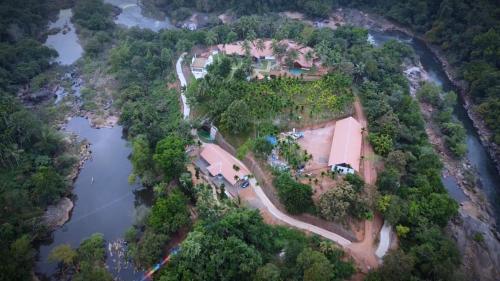 an aerial view of a house on an island in a river at Poliyam Thuruth Eco Tourism Village in Kāsaragod