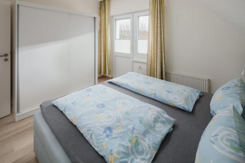 Postel nebo postele na pokoji v ubytování Haus Coordes Wohnung 04