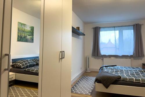 a bedroom with two beds and a window at Ferienwohnung Rode in Müden