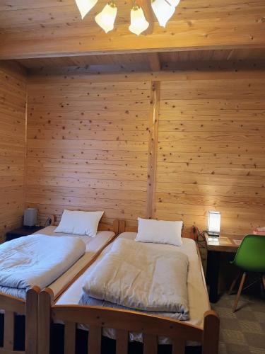 Postel nebo postele na pokoji v ubytování Pension Blue Drop
